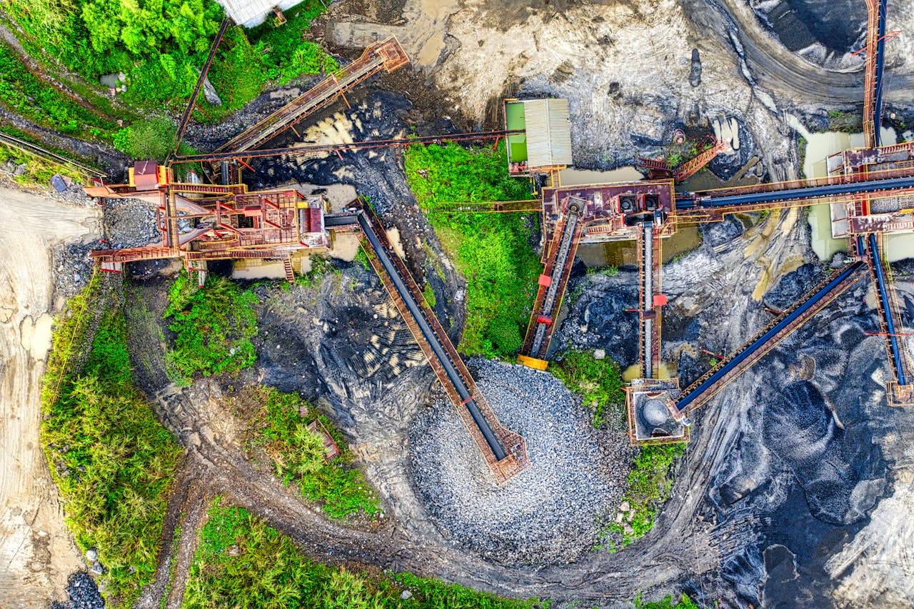 services-03 Drone view of a mining site in Rumpin, West Java with greenery and machinery.